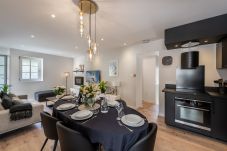 Spacious dining room with open kitchen overlooking the living room